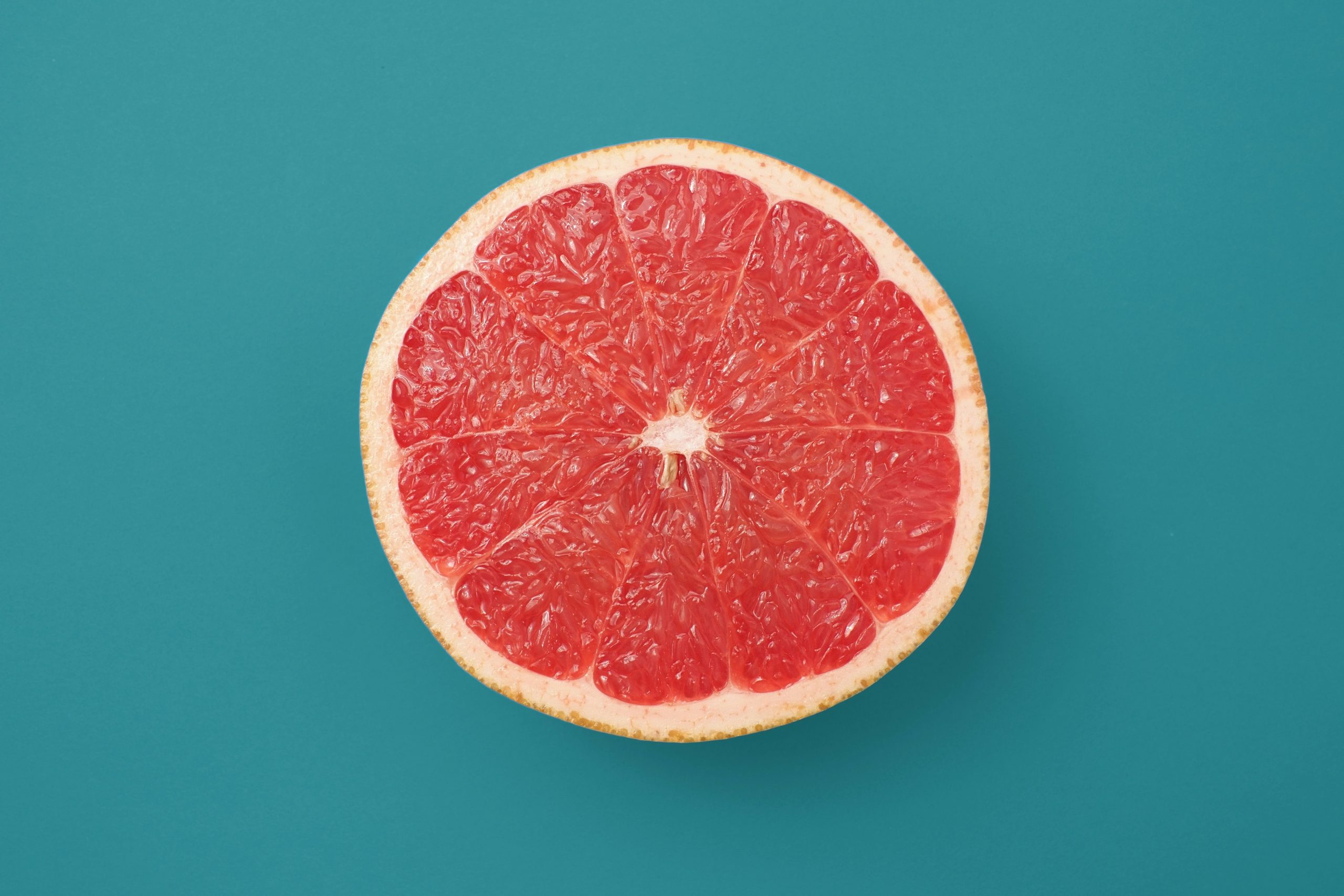 While grapefruit is a good low-GI fruit for people with diabetes, should caution be exercised when eating it with certain diabetes or high blood pressure medications?